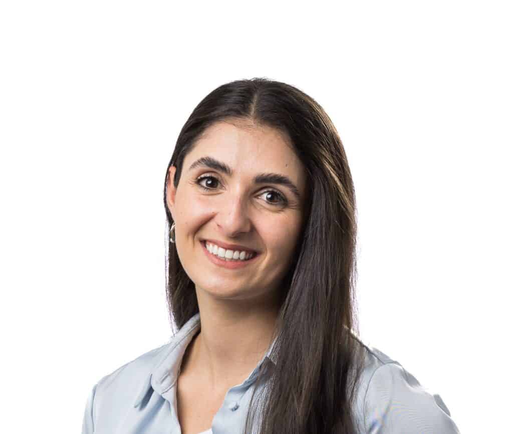 A headshot of Dr Rochelle Sleaby. She has long black hair and is wearing a blue shirt.